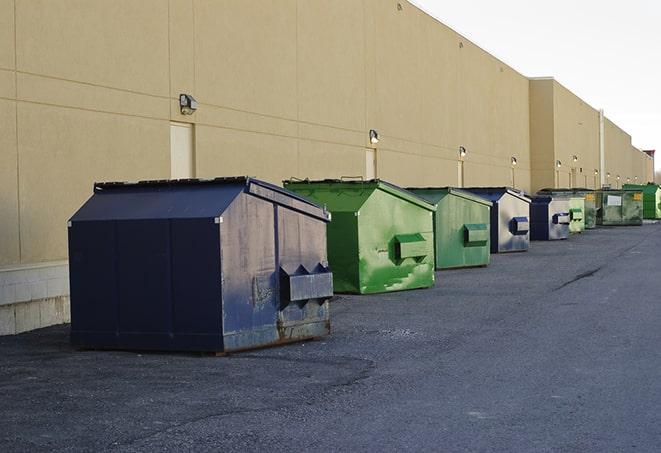 big yellow dumpsters on a construction lot in Cave City